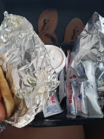 Spanish Dog with Fries and a Bag of Onion Rings